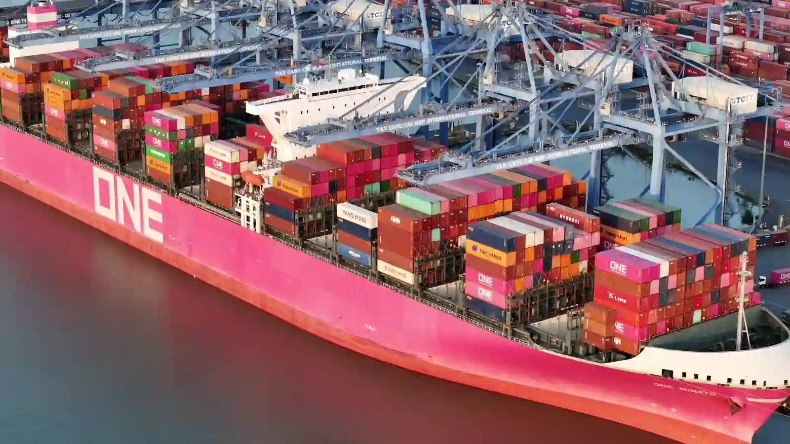 Container ship loading at a terminal